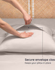 Person securing an envelope closure on a pillow with text indicating it keeps the pillow in place.