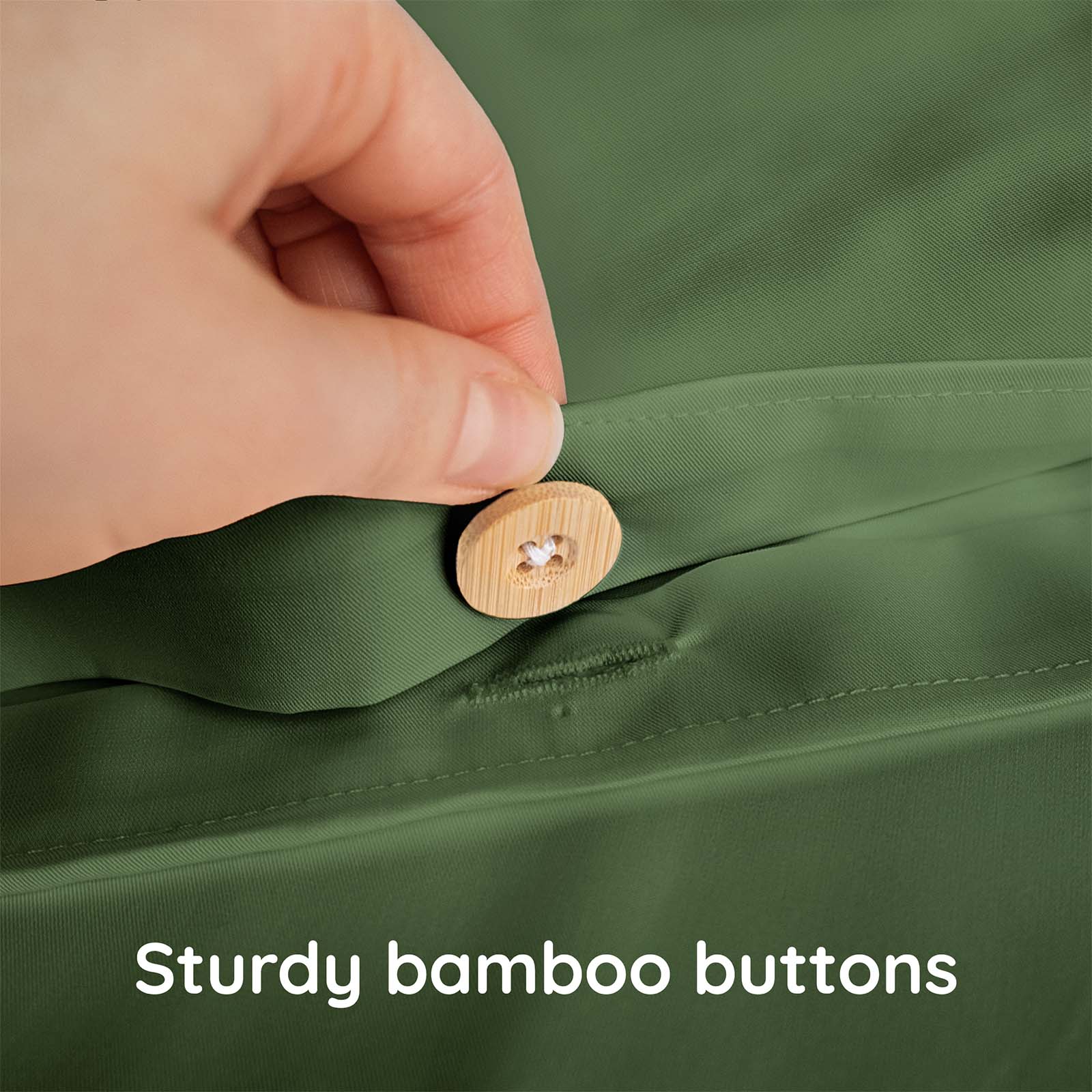 Hand pressing a wooden button on a green fabric with text &#39;Sturdy bamboo buttons&#39;.