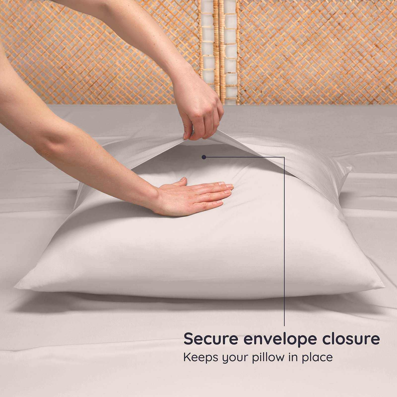 Person securing an envelope closure on a pillow with text indicating it keeps the pillow in place.