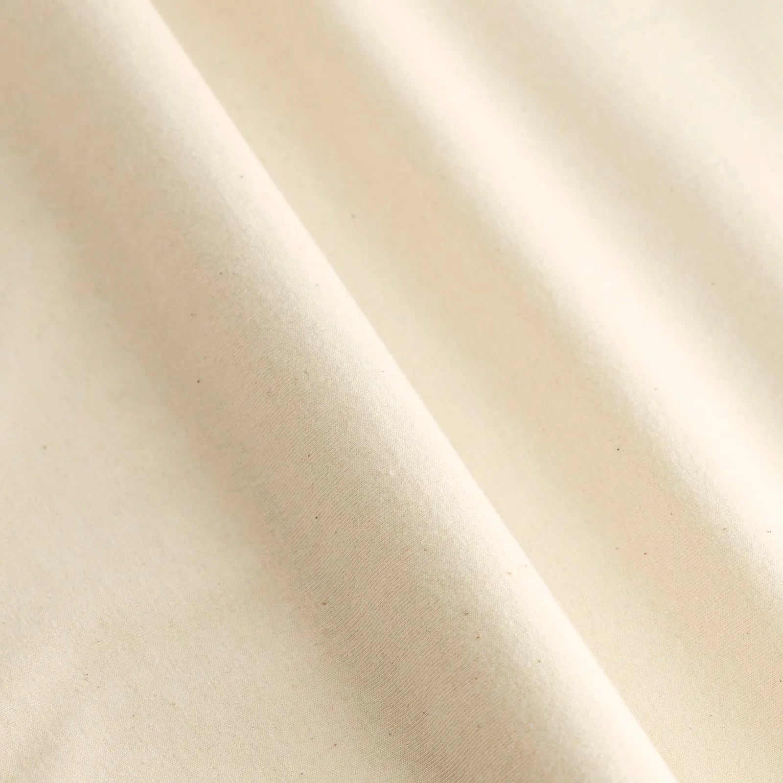 Close-up of natural raw white untreated fabric with a subtle texture 100% cotton City to Ocean donation