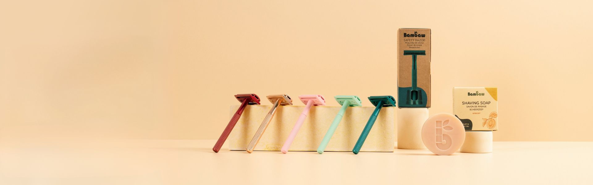 Set of bambaw safety razors and soap bar on a yellow background